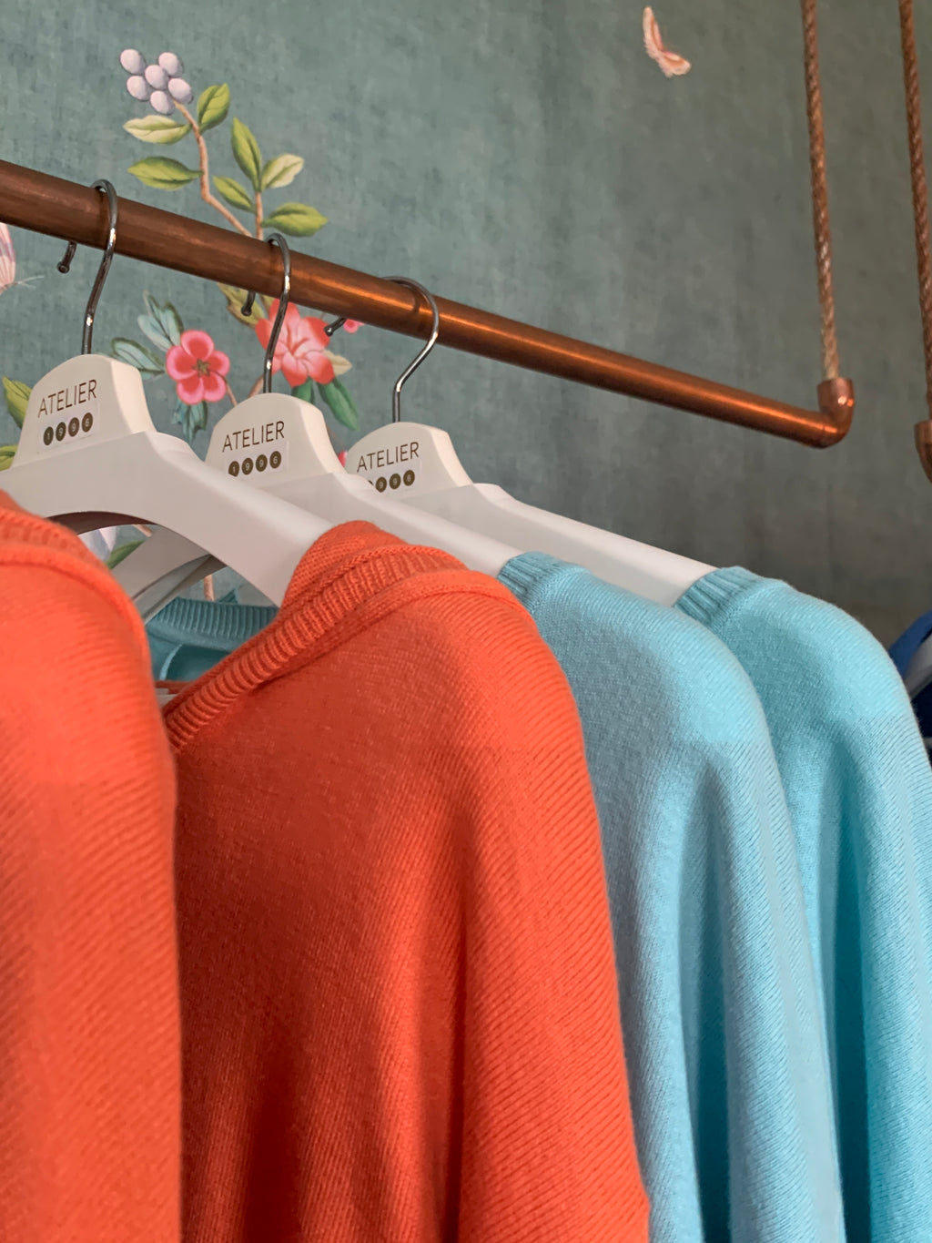 Baby blue cotton-silk sweater with a back neckline