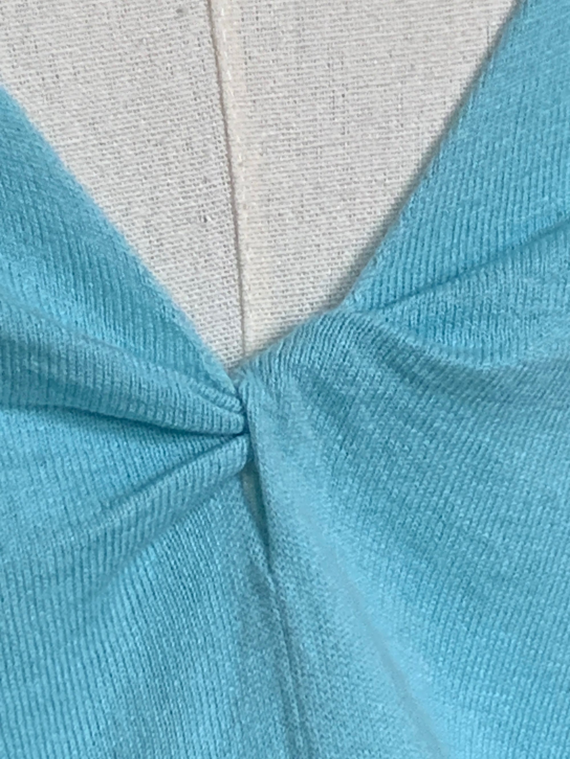 Baby blue cotton-silk sweater with a back neckline