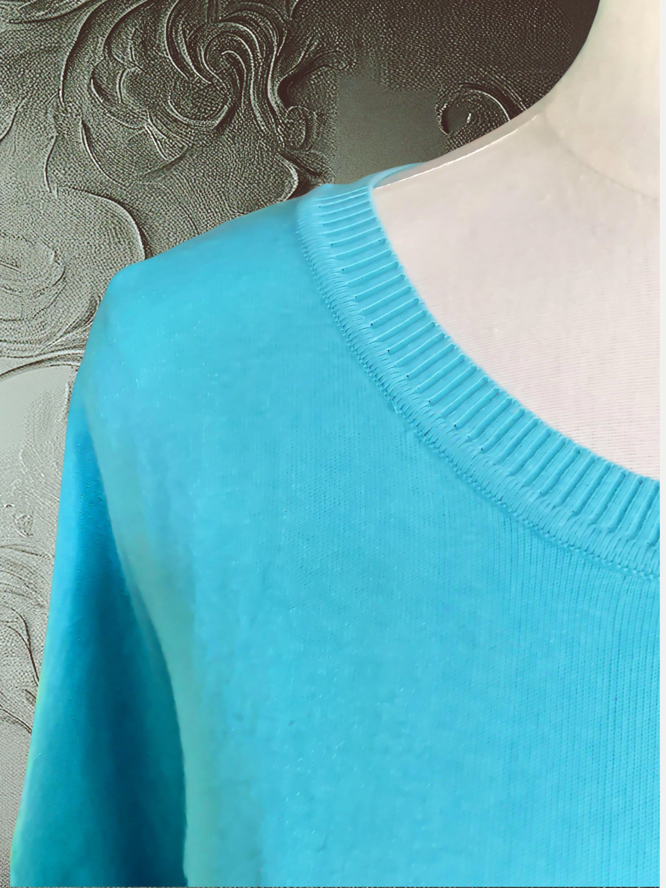 Baby blue cotton-silk sweater with a back neckline